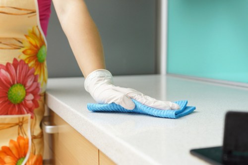 Warning sign placed on a damp carpeted floor during cleaning