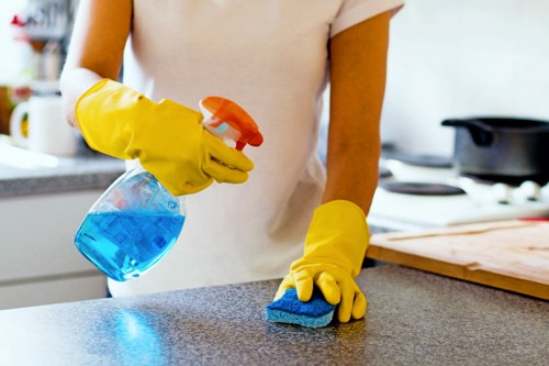 Technician preparing carpet cleaning equipment with safety measures in place