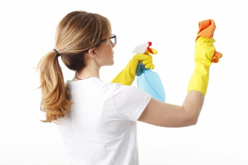 Professional using protective equipment during carpet cleaning